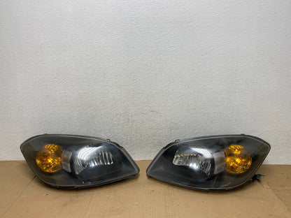 2005 - 2010 Chevrolet Cobalt Sedan Left+Right Set Headlights AE9100 DW0