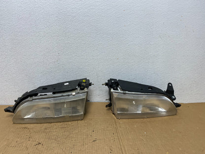1993 to 1997 Toyota Corolla Left+Right Side Headlights AC7722 DW0