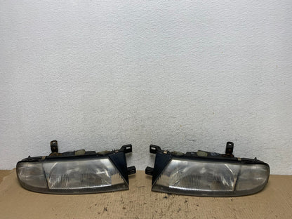 1993 to 1997 Nissan Altima Left+Right Side Set Halogen Headlights AF7256 DG0