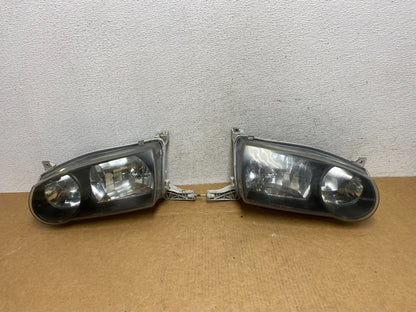 2001-2002 Toyota Corolla Left+Right Side Halogen Headlights AD4483 DW0