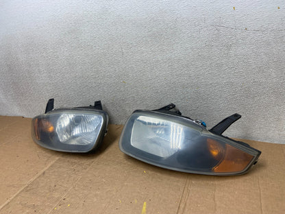 2003 - 2005 Chevrolet Cavalier Right+Left Black Headlight AA1441 PS1