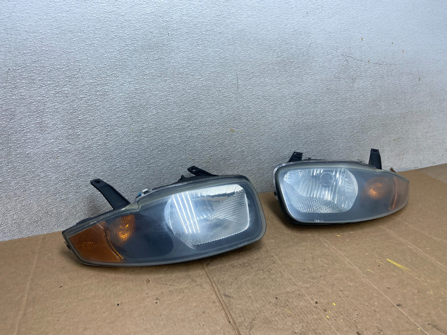 2003 - 2005 Chevrolet Cavalier Right+Left Black Headlight AA1441 PS2