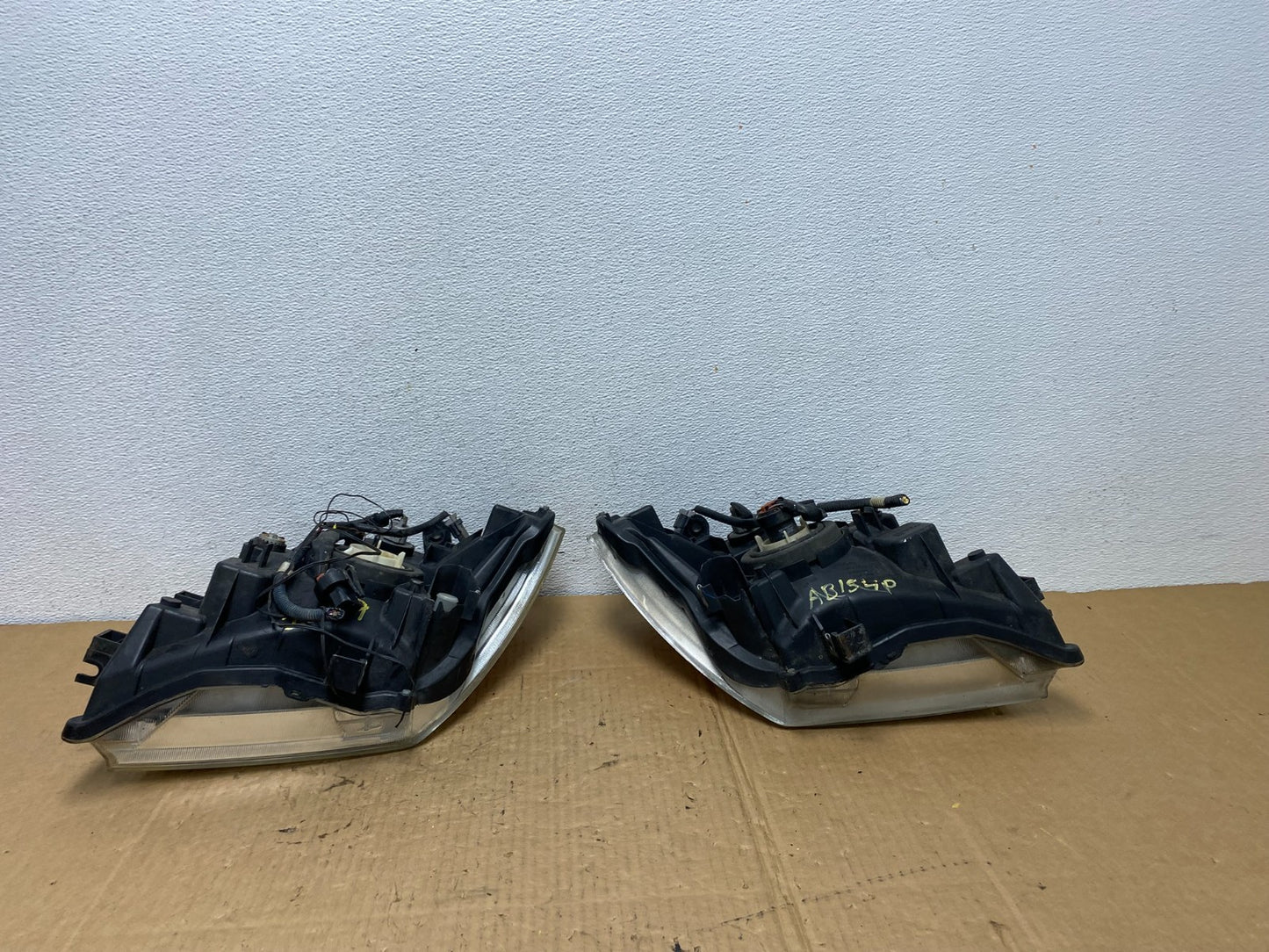 2005 2006 2007 Nissan Pathfinder Halogen Headlights Left+Right AC7709 DW8