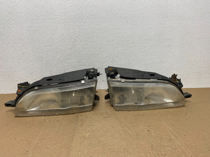 1993 to 1997 Toyota Corolla Left+Right Side Headlights AC5821 DW0
