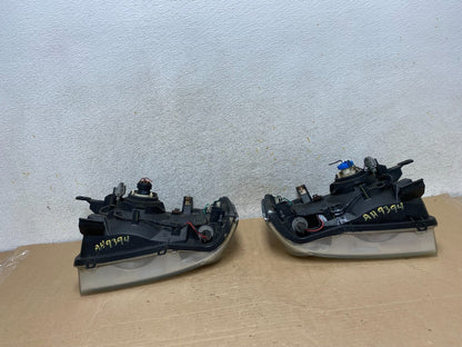 2001 to 2004 Nissan Frontier Left+Right Halogen Headlights AH9394 DW7