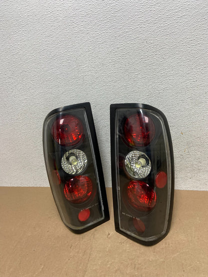 1998 to 2004 Nissan Frontier Left+Right Set Black Side Tail lights AE6773 DG0