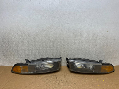 2002 to 2003 Mitsubishi Galant Left+Right Side Headlights V5990 DW0