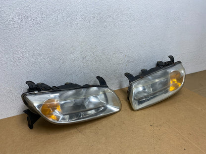 2000 to 2002 Saturn L Series Headlights Left+Right Side AE2945 DW2