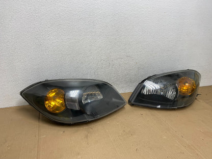2005 - 2010 Chevrolet Cobalt Sedan Left+Right Set Headlights AE9100 DW2