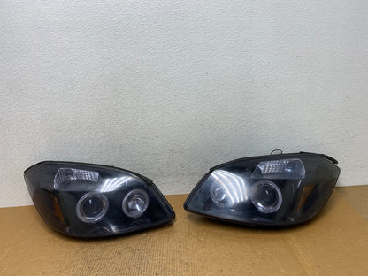2005 - 2010 Chevrolet Cobalt Sedan Left+Right Headlights AE1408 DG0