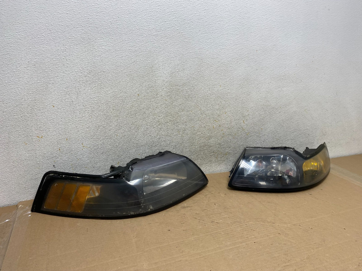 1999 to 2004 Ford Mustang Left+Right Set Side Black Headlights TYC AH9393 DW2
