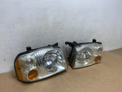 2001 to 2004 Nissan Frontier Left+Right Halogen Headlights AH9394 DW2