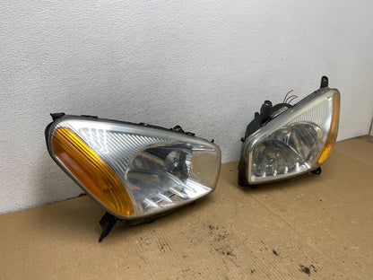 2001 - 2003 Toyota Rav4 Left+Right Side Headlights Halogen TYC AG2308 DW2