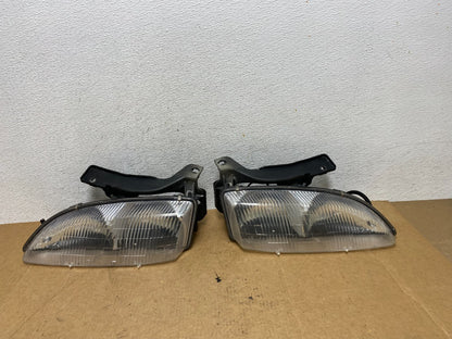 1995 to 1999 Chevrolet Cavalier Left+Right Set Halogen Headlight AE3227 DG0