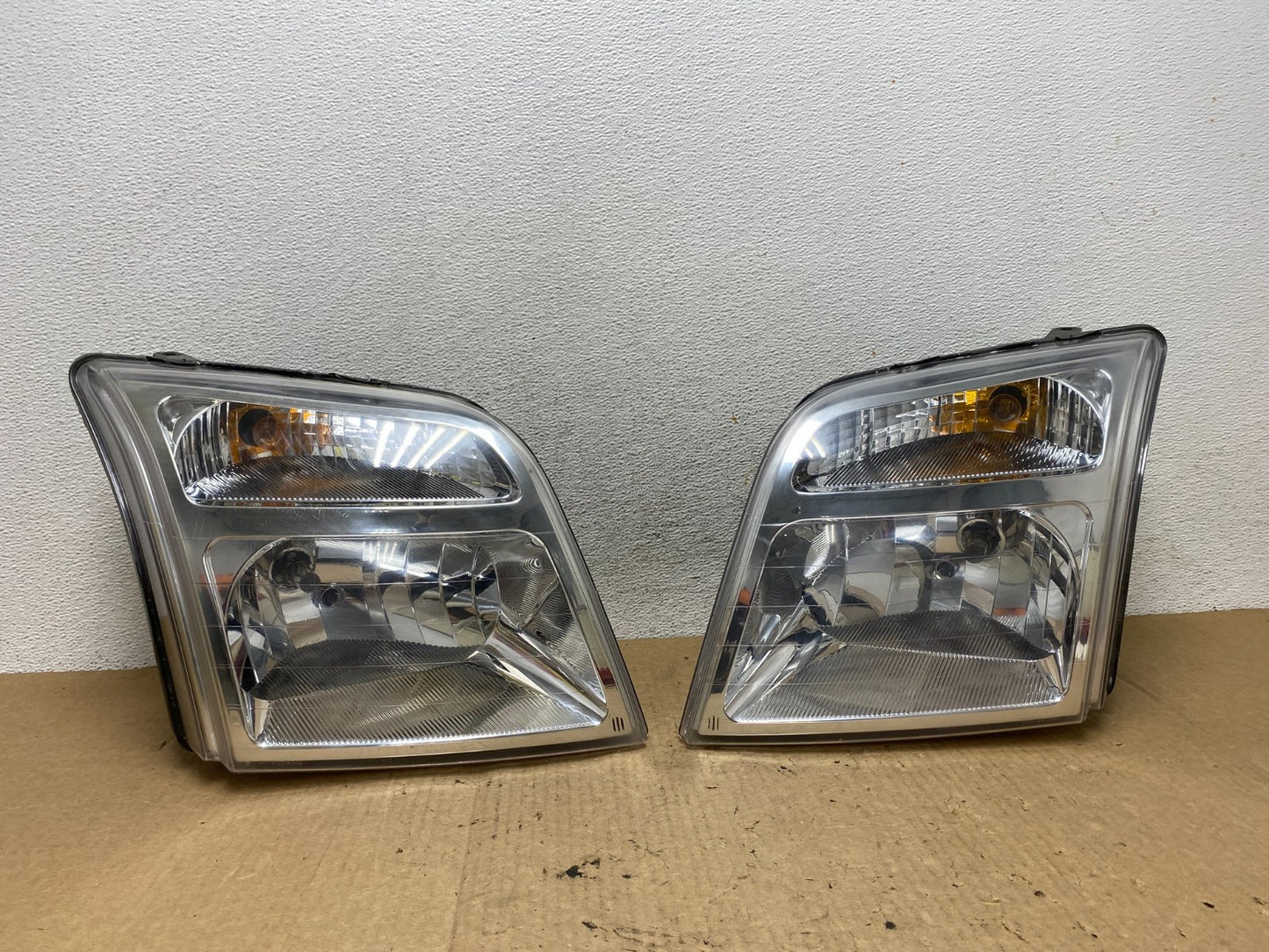 2010 to 2013 Ford Transit Connect Left+Right Side Headlights AF9775 DW0