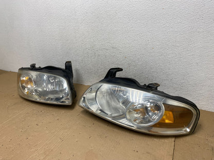 2004 - 2006 Nissan Sentra Halogen Left+Right Headlights AE9226 DW1