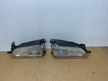 1993 to 1997 Toyota Corolla Left+Right Side Headlights AE3065 DW0