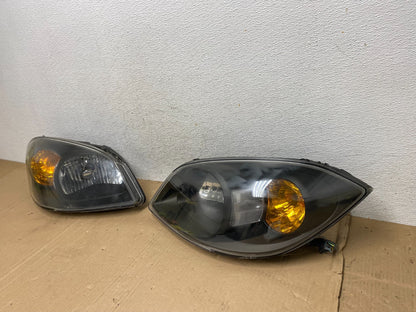 2005 - 2010 Chevrolet Cobalt Sedan Left+Right Set Headlights AE9100 DW1