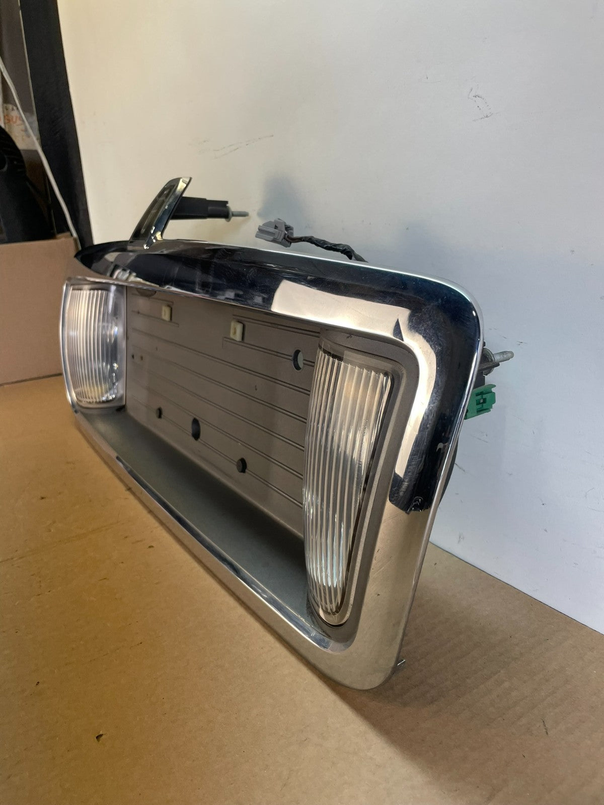 2003 to 2011 Lincoln Town Car Rear License Plate Trim Panel AH6422 DG1