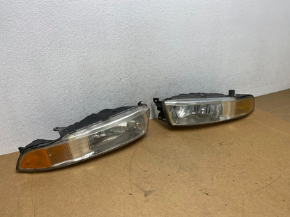 2002 to 2003 Mitsubishi Galant Left+Right Side Headlights AE3173 DW2