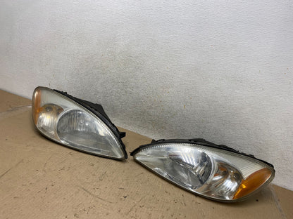 2000 to 2007 Ford Taurus Left+Right Side Halogen Headlights AH7649 DW2