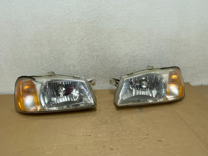 2000 to 2002 Hyundai Accent Left+Right Halogen Headlights AG8955 DW0