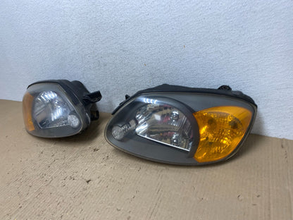 2003 to 2006 Hyundai Accent Left+Right Halogen Headlights AF2824 DW1