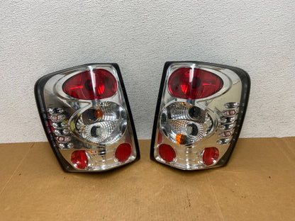 1999-2004 Jeep Grand Cherokee Left + Right Set Chrome Tail Lights AD8971 DG0