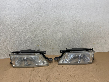 1997 to 1999 Nissan Maxima Left+Right Side Headlights Halogen OEM W1069 DW0