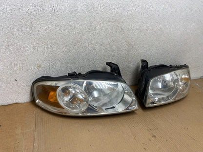 2004 - 2006 Nissan Sentra Halogen Left+Right Headlights AH3044 DW1